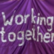 Foto von einem Banner mit der Aufschrift "working together"
